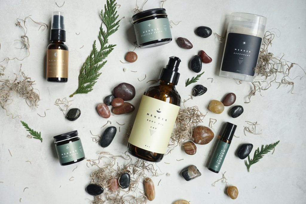 Luxury skincare products, stones and greenery on white background - don't wait for the perfect moment to use them or start your email marketing